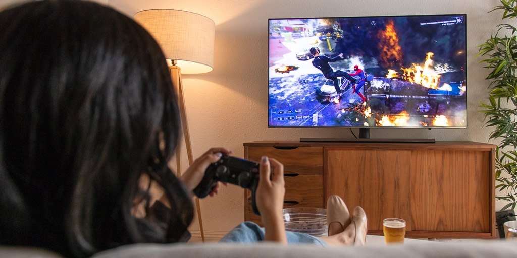 Image Showing a woman playing video games in her leisure time.