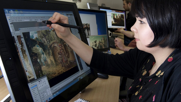 A Woman pointing something towards the screen.